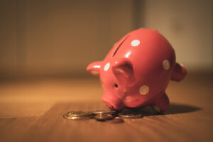 Photo of piggy bank with coins